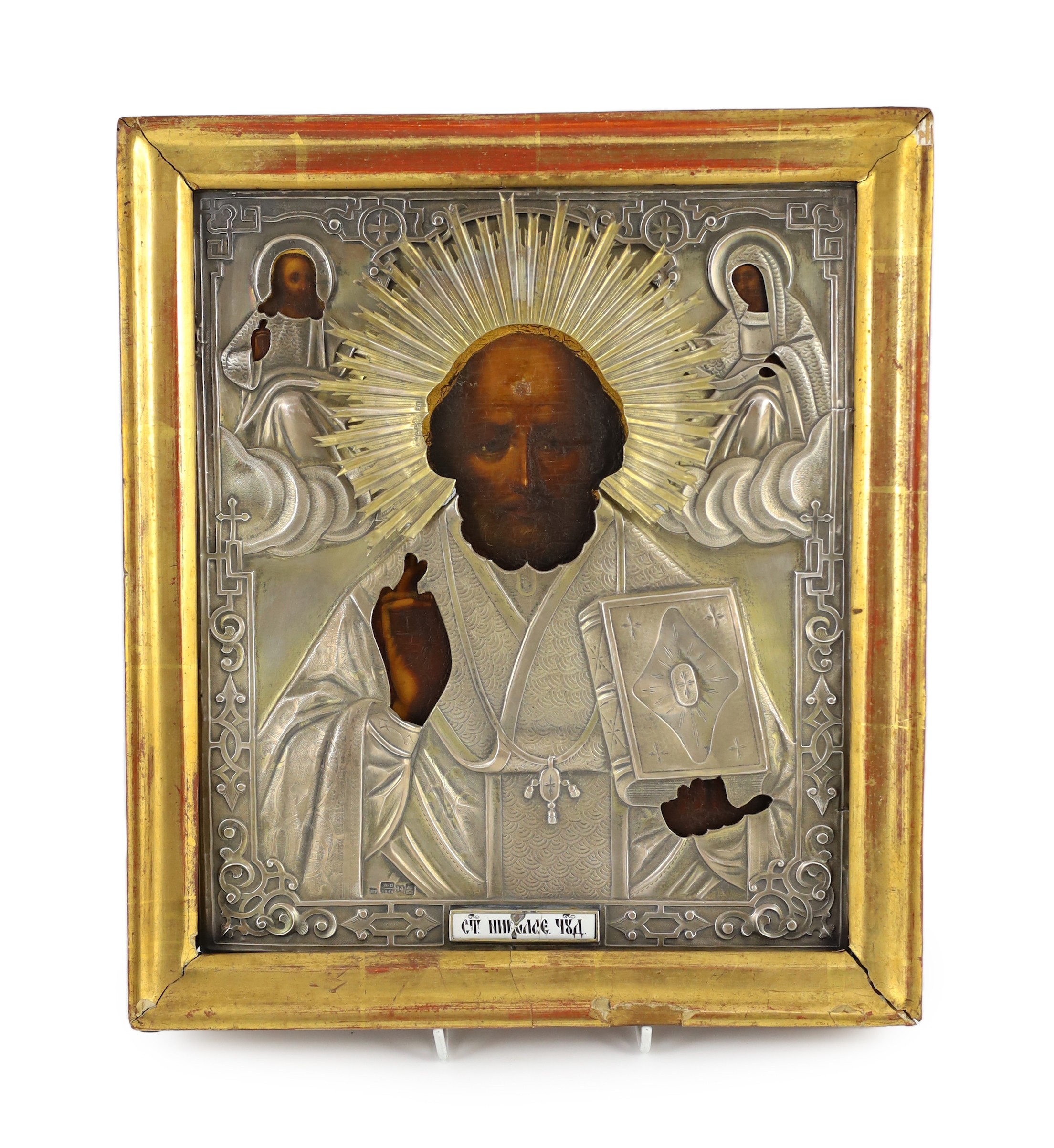 A 19th century Russian icon of St. Nicholas with 84 zlotnik oklad dated 1862, 30 x 26cm